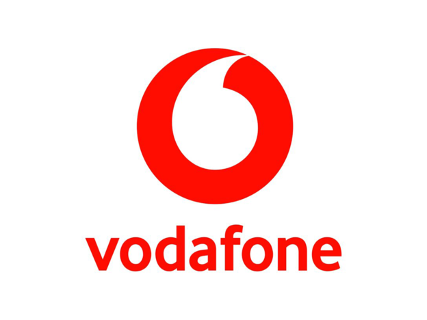 Das Logo von Vodafone zentriert auf weißem Hintergrund. Oben befindet sich das Bildsymbol: Ein roter Kreis, in dessen Mitte ein weißes, stilisiertes Anführungszeichen ausgespart ist. Darunter steht in einer modernen, roten Serifenschrift in Kleinbuchstaben der Markenname „vodafone“.